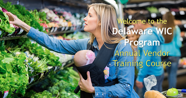 Woman holding baby while choosing fresh greens